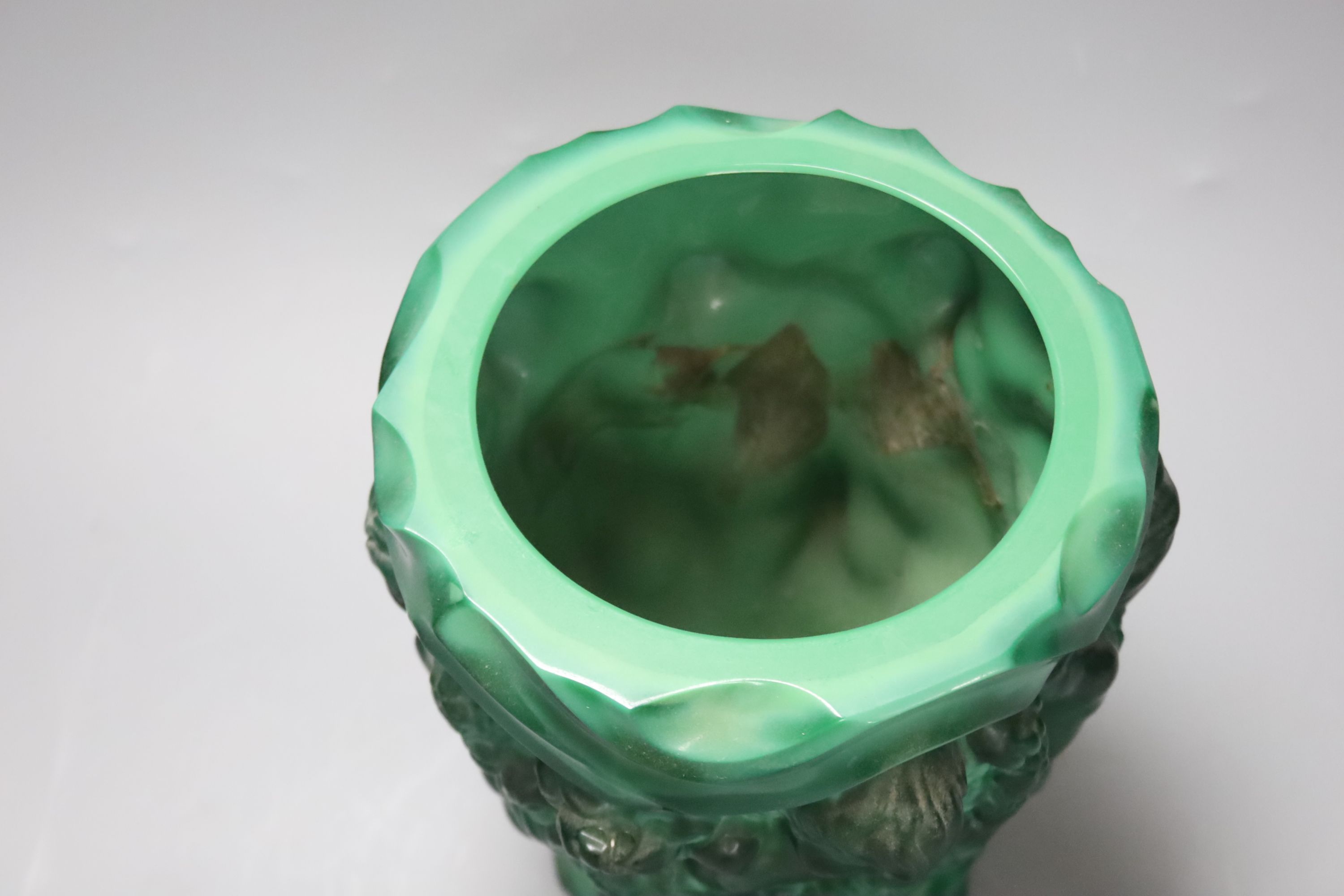 A Czech malachite glass vase with cherubs designed for Schlevogt, c.1920, height 19cm